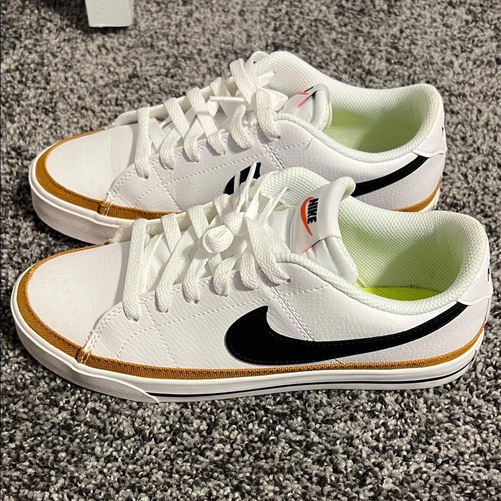 Nike White Sneakers with Black and Gold Details